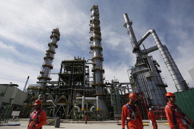 FILE PHOTO: Employees walk at Mexico's national oil company Pemex's refinery in Salamanca